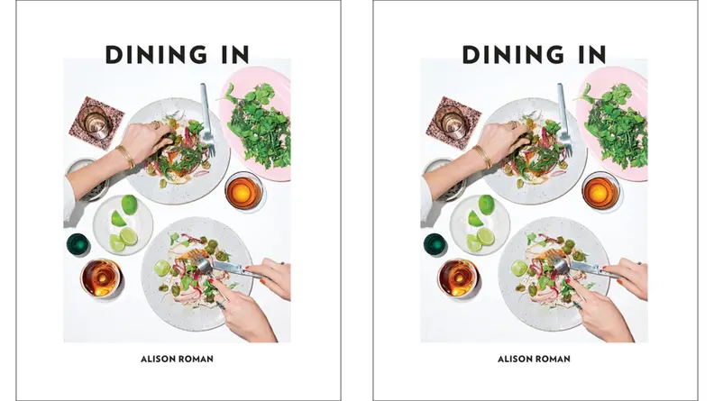 A couple of individuals, standing just out of frame, prepare dinner at home. (This is the cover for a book called Dining In, by Alison Roman.)