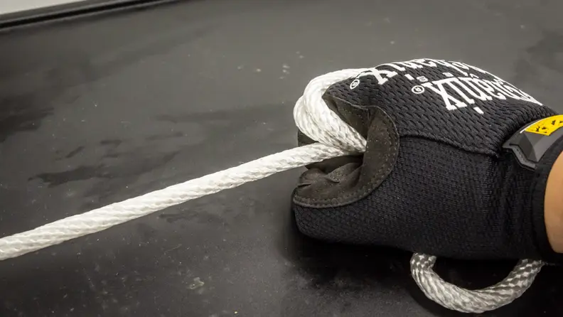 Part of the testing includes constricting a length of rope around each glove.