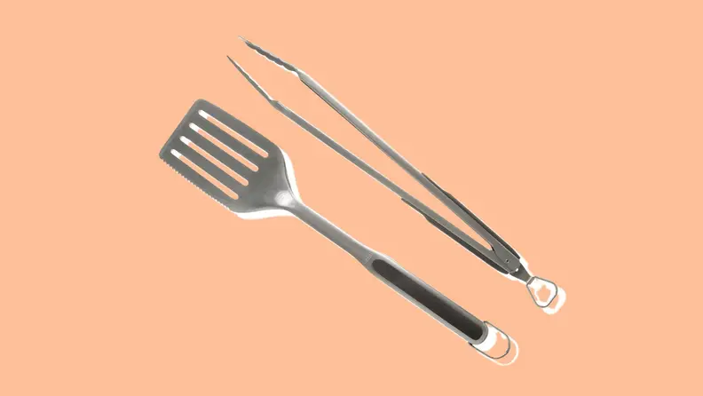OXO grill spatula and tongs on peach background