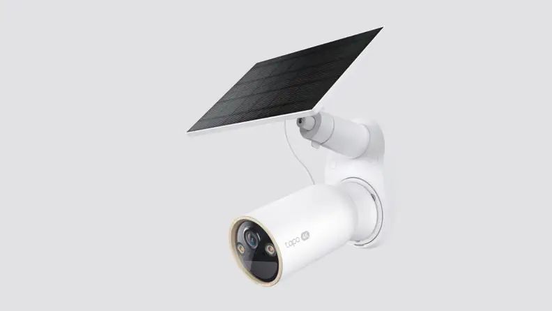 A security camera placed on a gray background