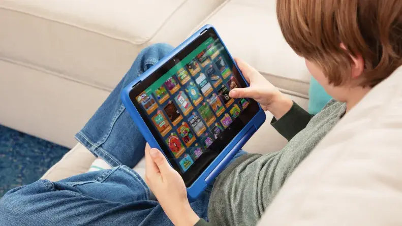 A child plays with a Kindle Fire