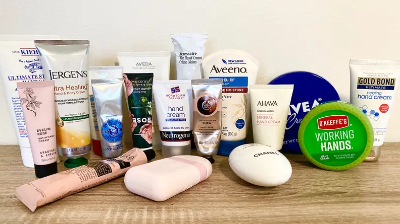 All of the hand creams sitting on a table.