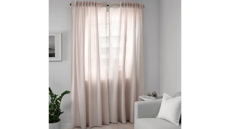 A dusty blush pink color makes these curtains look romantic in any room