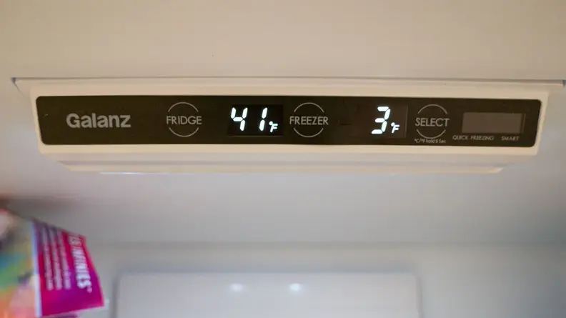 A close-up of the fridge's control panel  where the digital temperature readout states that the fridge is currently at 41°F and its freezer is 3°F.