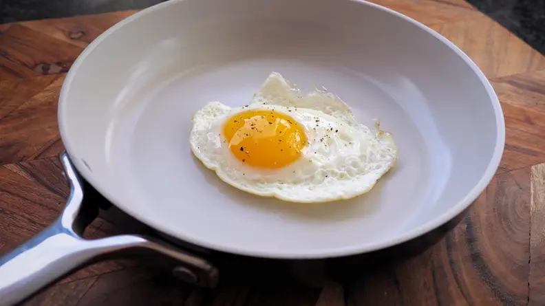 An egg frying in the Equal Parts frying pan.