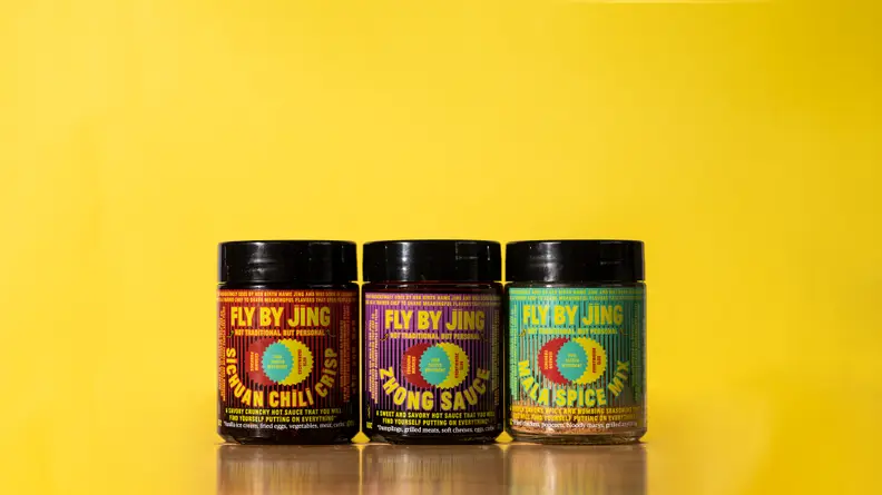 There are three jars of sauces and spice blends by Fly By Jing. From the left, there's the Sichuan Chili Crisp, Zhong Sauce, and Mala Spice Mix.