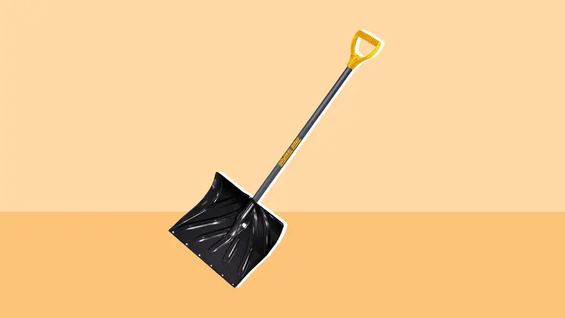 Snow shovel on an Orange background.