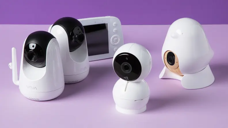 A bunch of baby monitors on a purple background.
