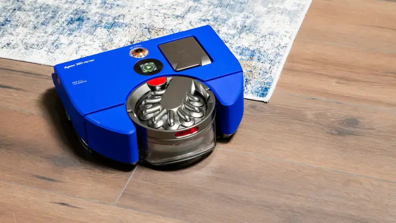 Dyson 360 visnav on the corner of a blue gradient carpet