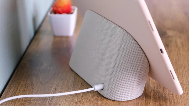 A photo of the Pixel tablet and it's included charging doc.
