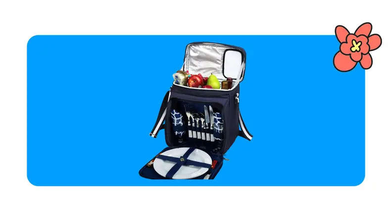 Blue insulated picnic cooler with plates and cutlery on a blue background