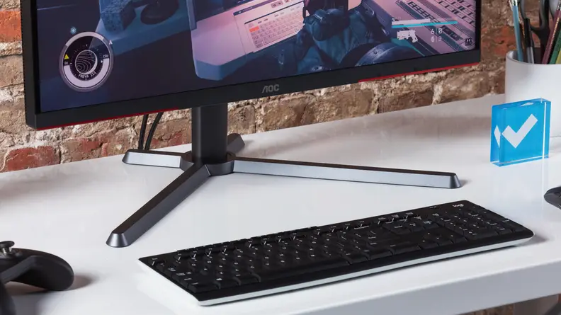 The AOC’s Q27G3XMN atop a cross-shaped stand