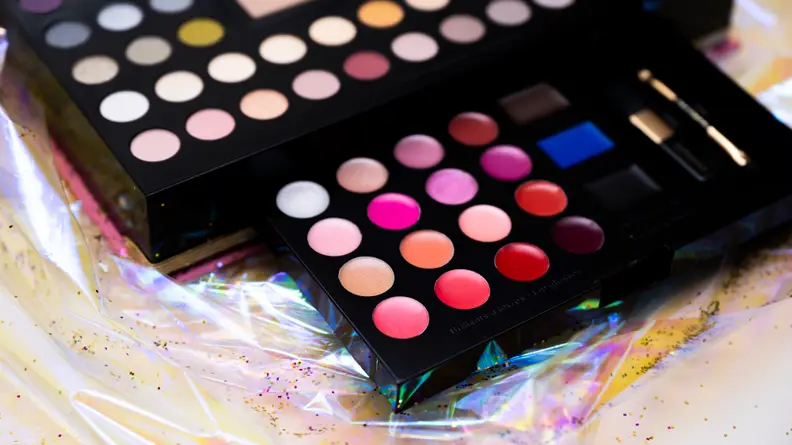 A closeup on the lip glosses in a makeup palette.