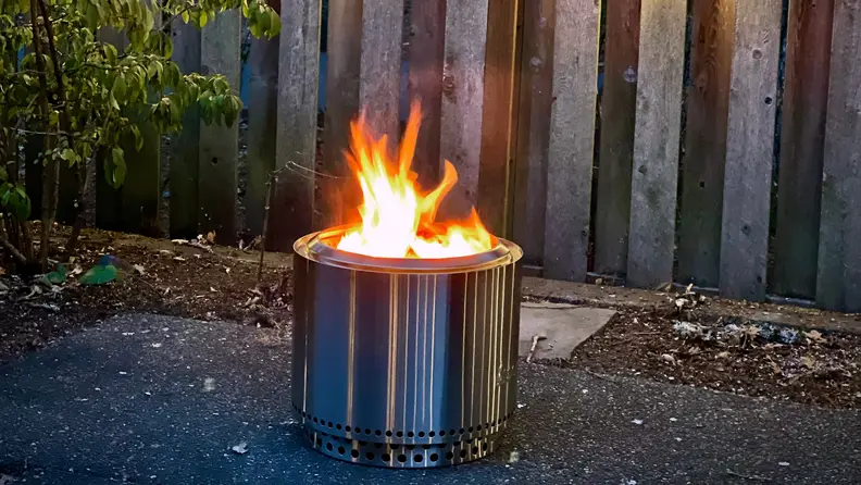 A Solo Stove smokeless fire pit burns in our testers backyard.