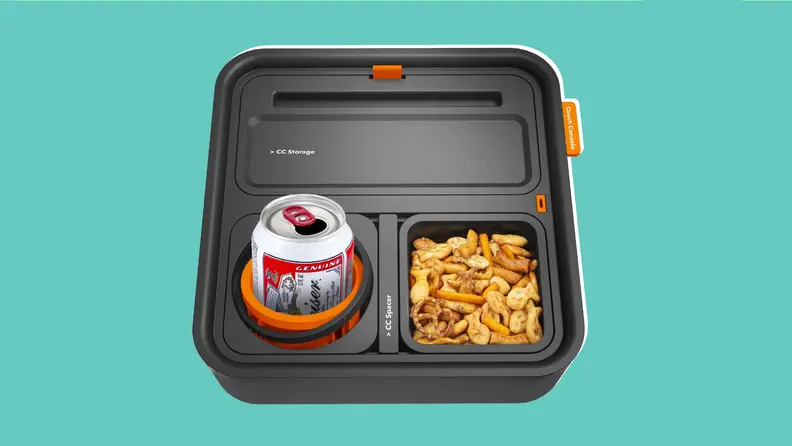 Couchconsole tray with drink and food on a blue background