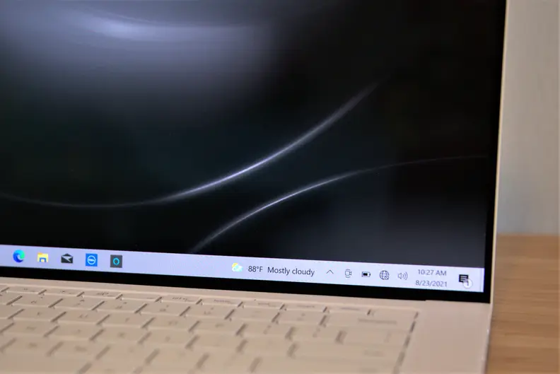 A Dell XPS 15 with OLED display on a desk.