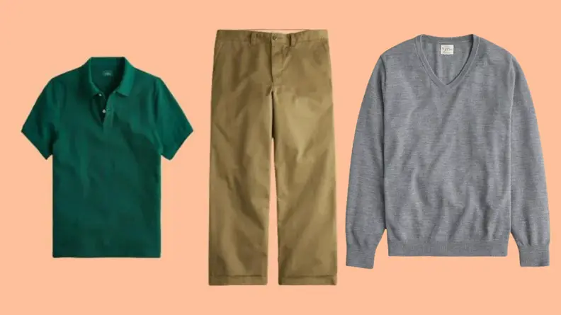 Green polo shirt, khaki oversized pants, and wool v-neck sweater against salmon background