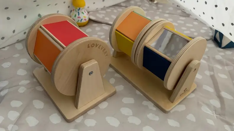 Two spinning drum toys side-by-side.