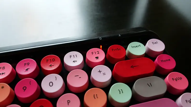 Close-up of the Ubotie Bluetooth Mechanical Keyboard battery light indicator above its keys.