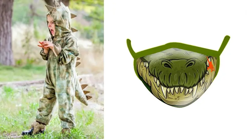 A child in a dinosaur costume with spikes. A ferocious dinosaur mask for a t-rex.