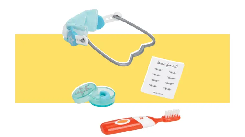 An American Girl Healthy Smile Set on a yellow background.
