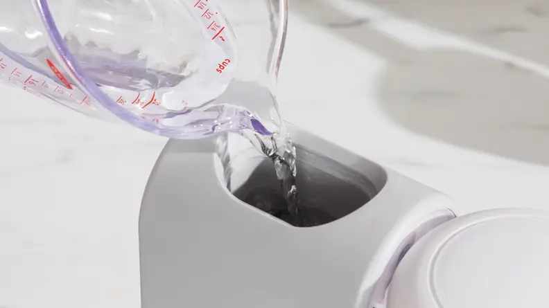 Water being poured into the top of the Beaba Babycook Express
