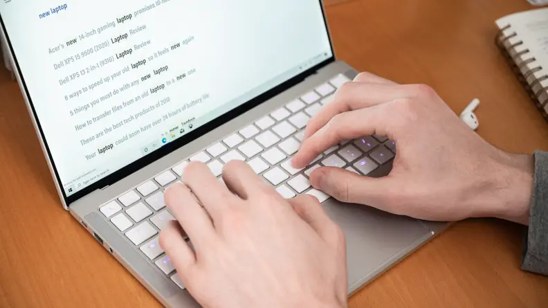 A person types on the keyboard