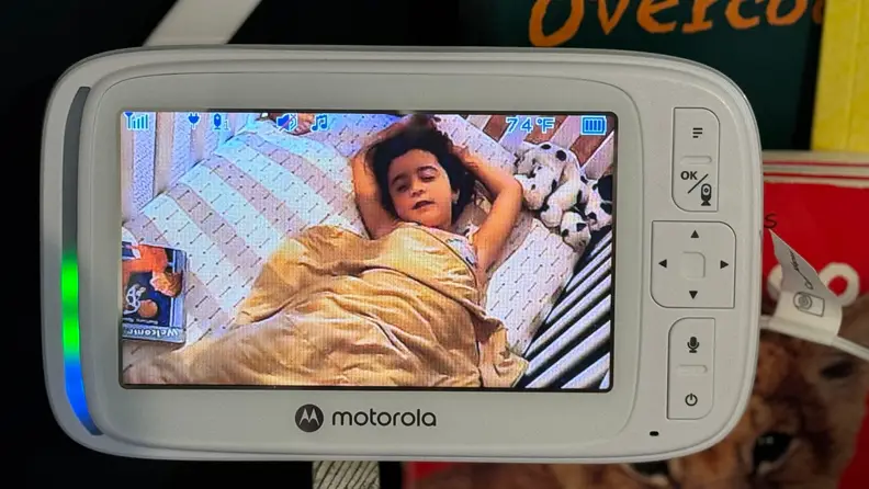 The baby monitor displaying a sleeping infant.