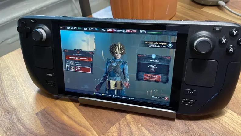 A Steam Deck in the color black featuring the Diablo 4 video game on the screen.