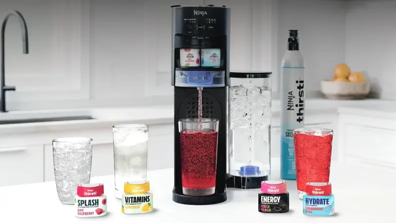 The Ninja Thirsti surrounded by prepared drinks and their supplementary vitamins atop a table.