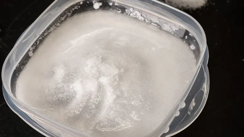 After the first minute, the table salt turned the surface of the ice block into slush.