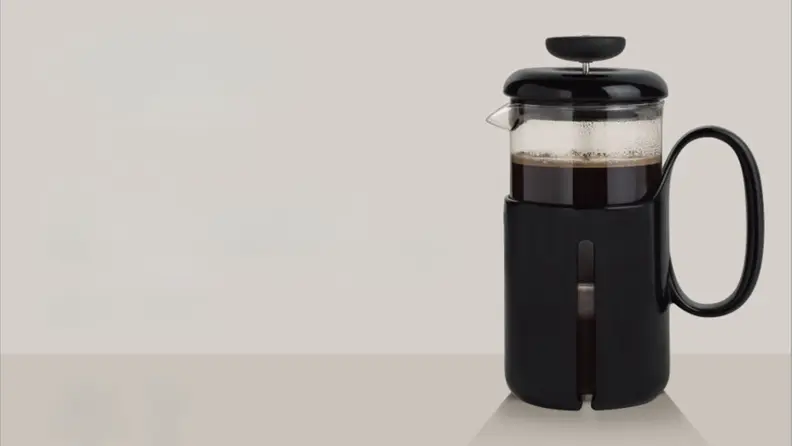 OXO French press on beige background