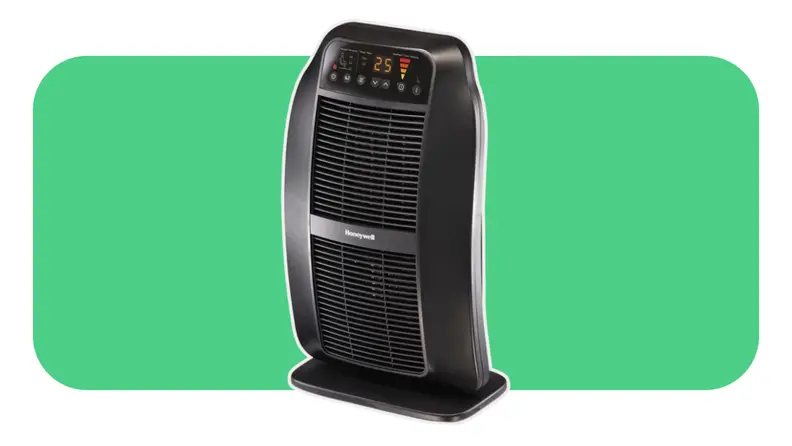 A black Honeywell HCE840B space heater on a green background.