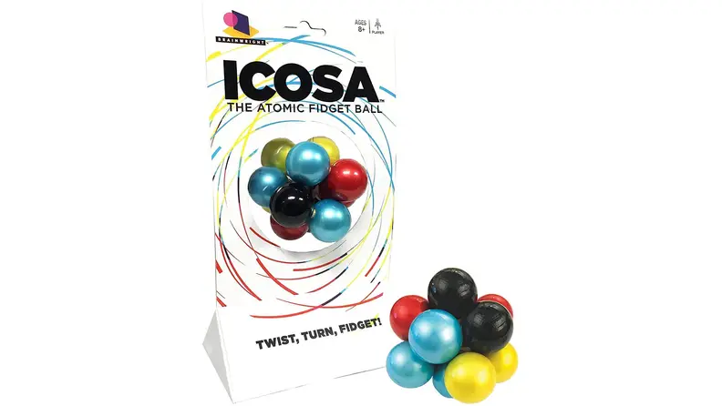 An atomic puzzle ball sits with its packaging.