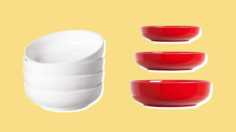 On the left: A stack of four white pasta bowls. On the right: Three different sized red pasta bowls.