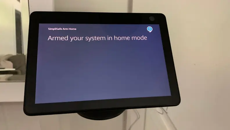 Amazon Echo Show 10 controlling a SimpliSafe wireless home security system.