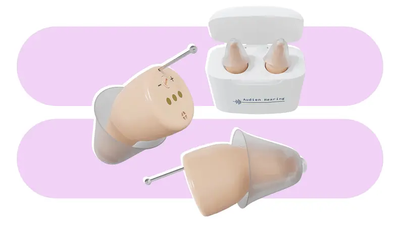 Audien Atom Pro hearing aids on a blue and white background