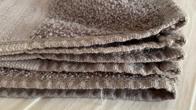 Close-up of gray towel fraying on the edges