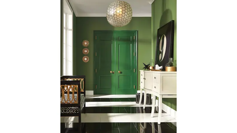 This deep green door is painted with Sherwin-Williams-Arugula