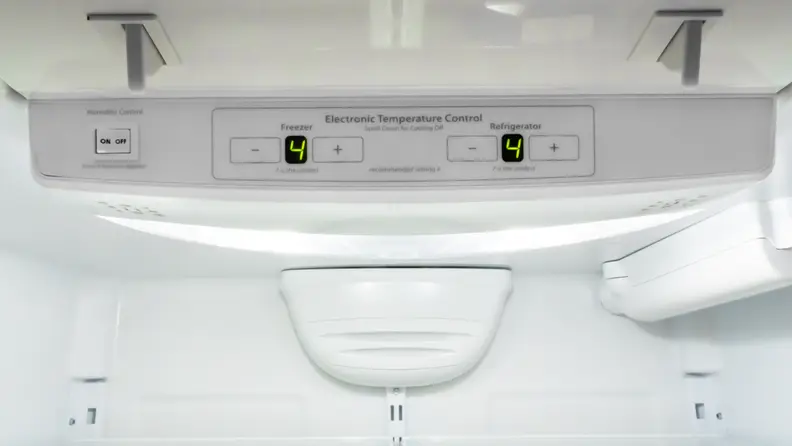 On the inside ceiling of a refrigerator, an electronic panel offers controls for fridge temperature, freezer temp, and humidity.