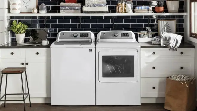 White washing machine and dryer set in a chic laundry room