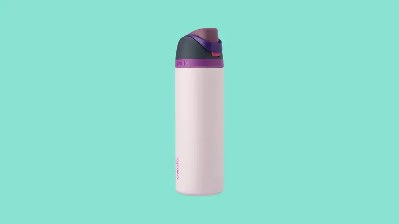 An Owala stainless steel water bottle with a purple and black cap on a dark teal background.