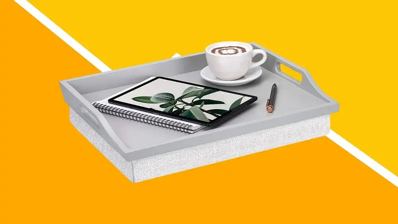 A white tray table against a yellow background.