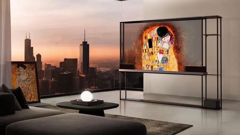 The 77-inch OLED T transparent TV displaying modern art in an upscale condominium overlooking a city skyline at dusk