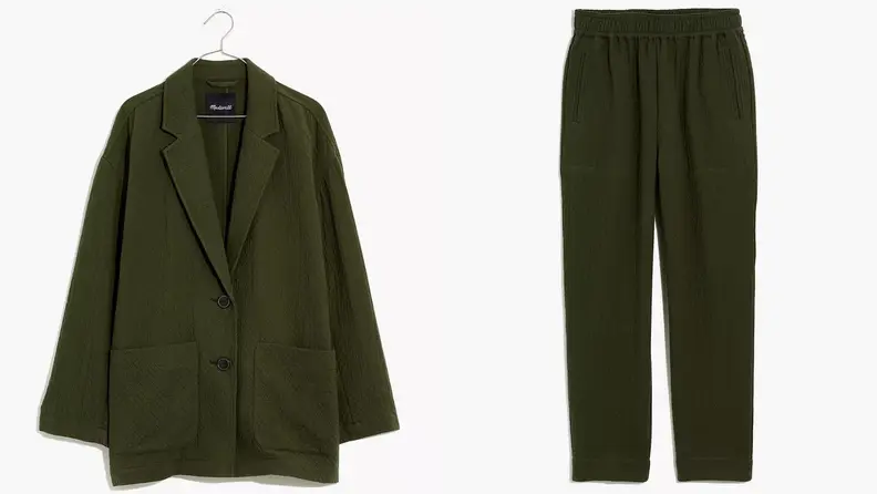 A dark green blazer and dark green pants.