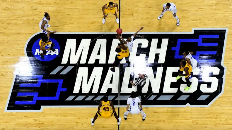 Men playing basketball over a court that says "March Madness"