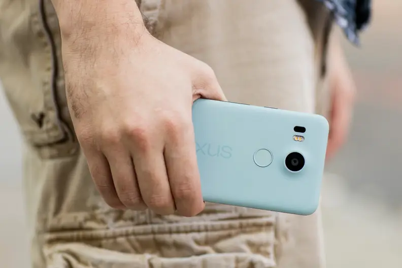 The Nexus 5X being held at a man's side.