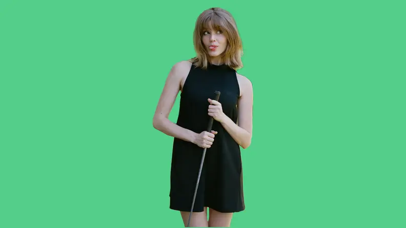 woman wearing black dress on green background