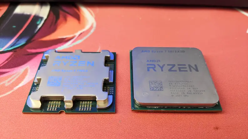 Two computer processors side by side, right side up, on top of a mat.