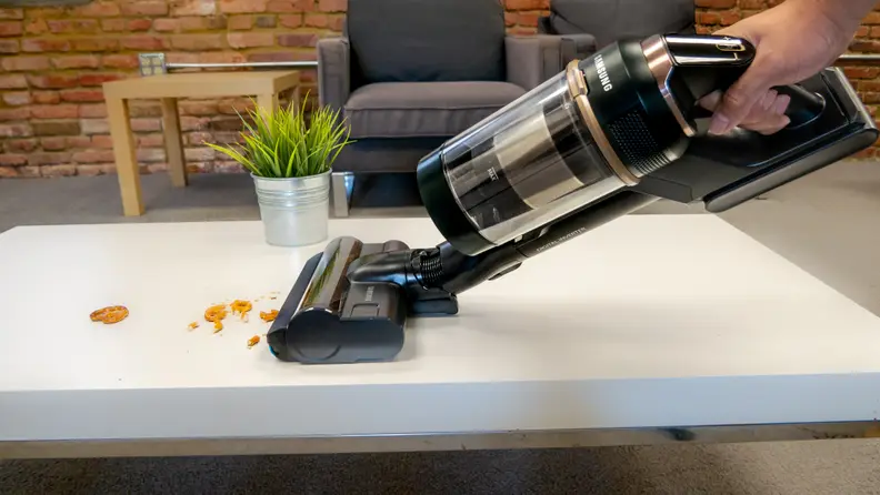 The Samsung Bespoke Jet cleaning off a table